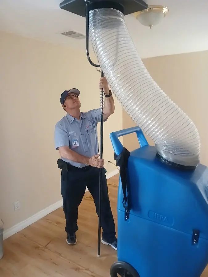 HVAC Installation technician using HEPA equipment in Holly